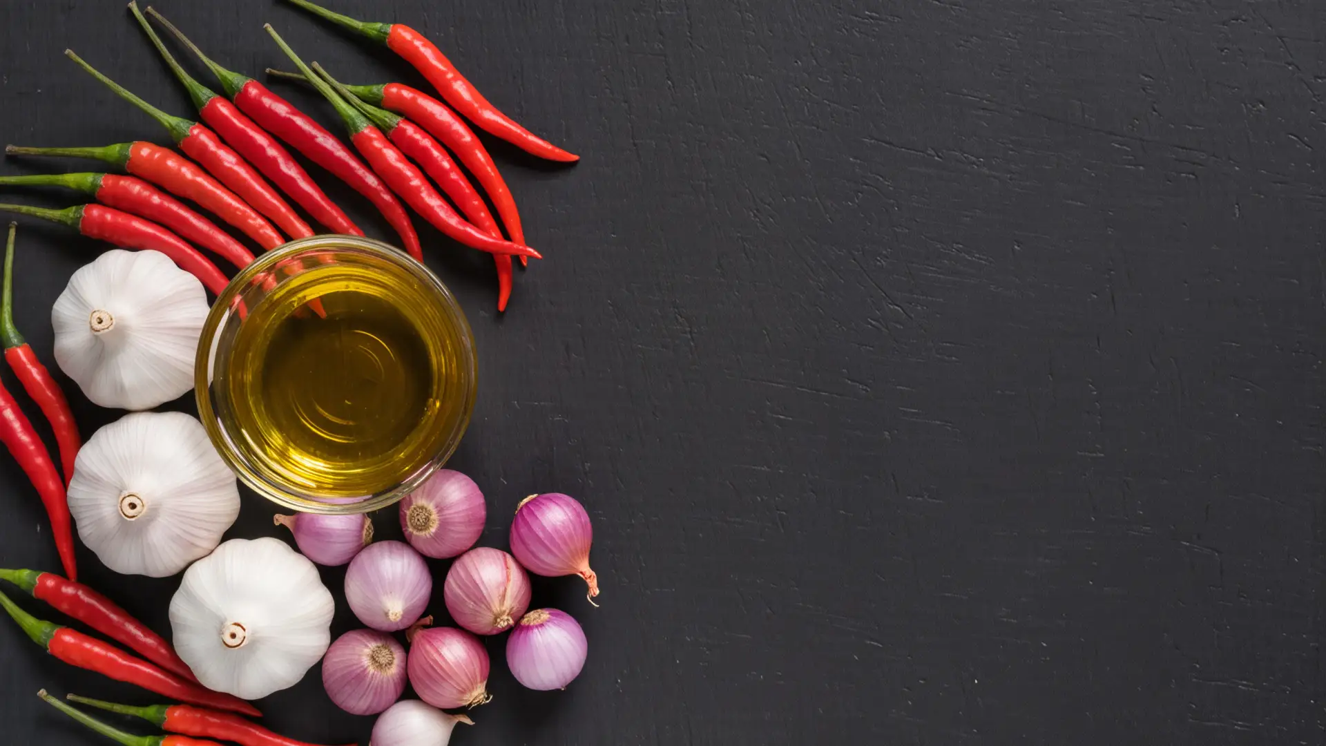 Fresh Indonesian ingredients including chilies, shallots, and spices